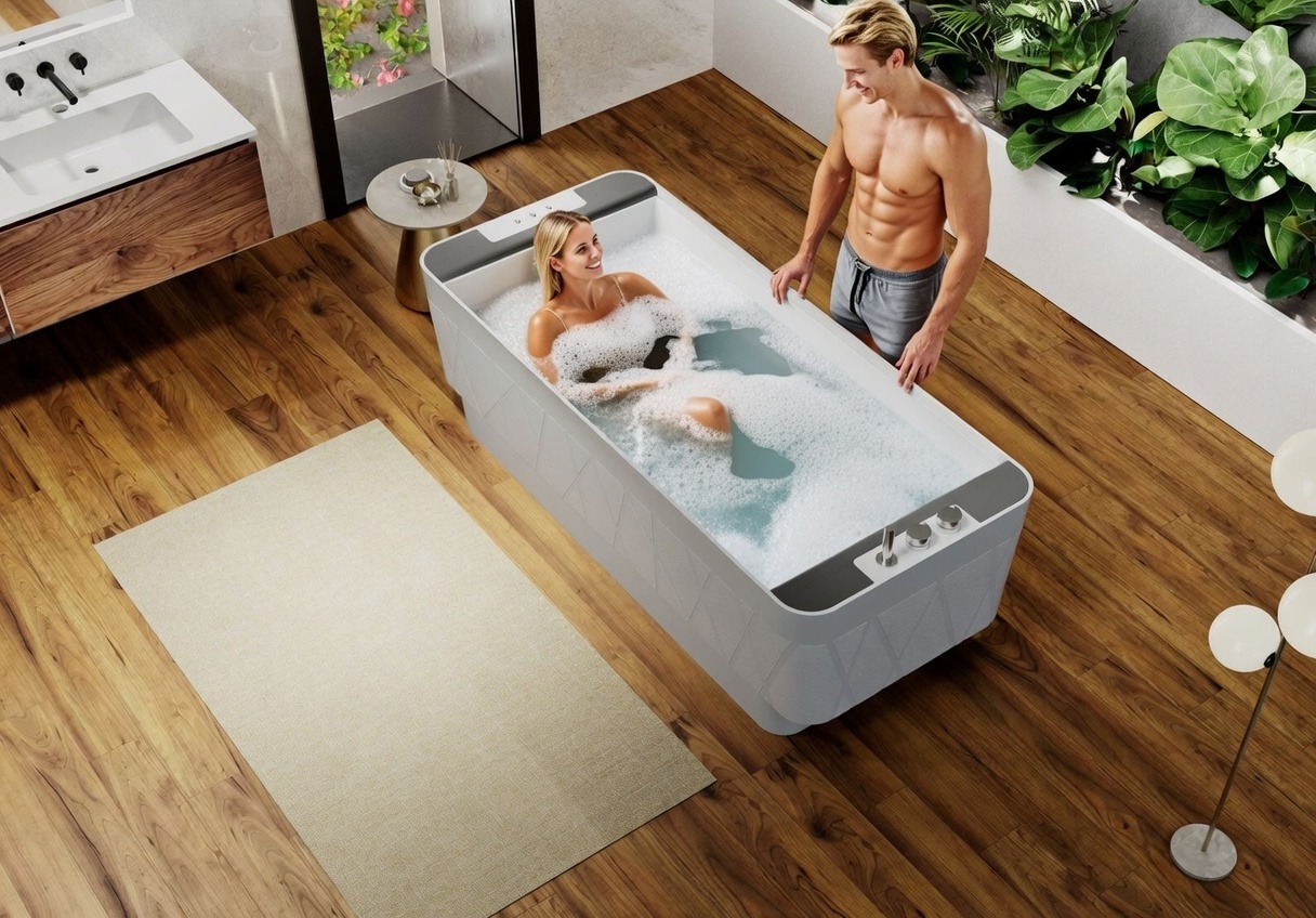 Baignoire balnéo îlot droite KINÉDO GLAMOUR 180x80 Solid surface effet débordement d'eau système AIR EQUILIBRE tête bain à gauche